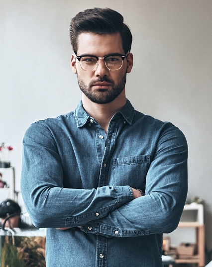 young-successful-handsome-young-man-looking-camera-keeping-arms-crossed 1